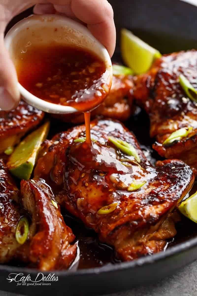 Sriracha sauce poured on Honey Garlic Sriracha Chicken