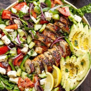 Loaded Greek Chicken Avocado Salad on a huge plater