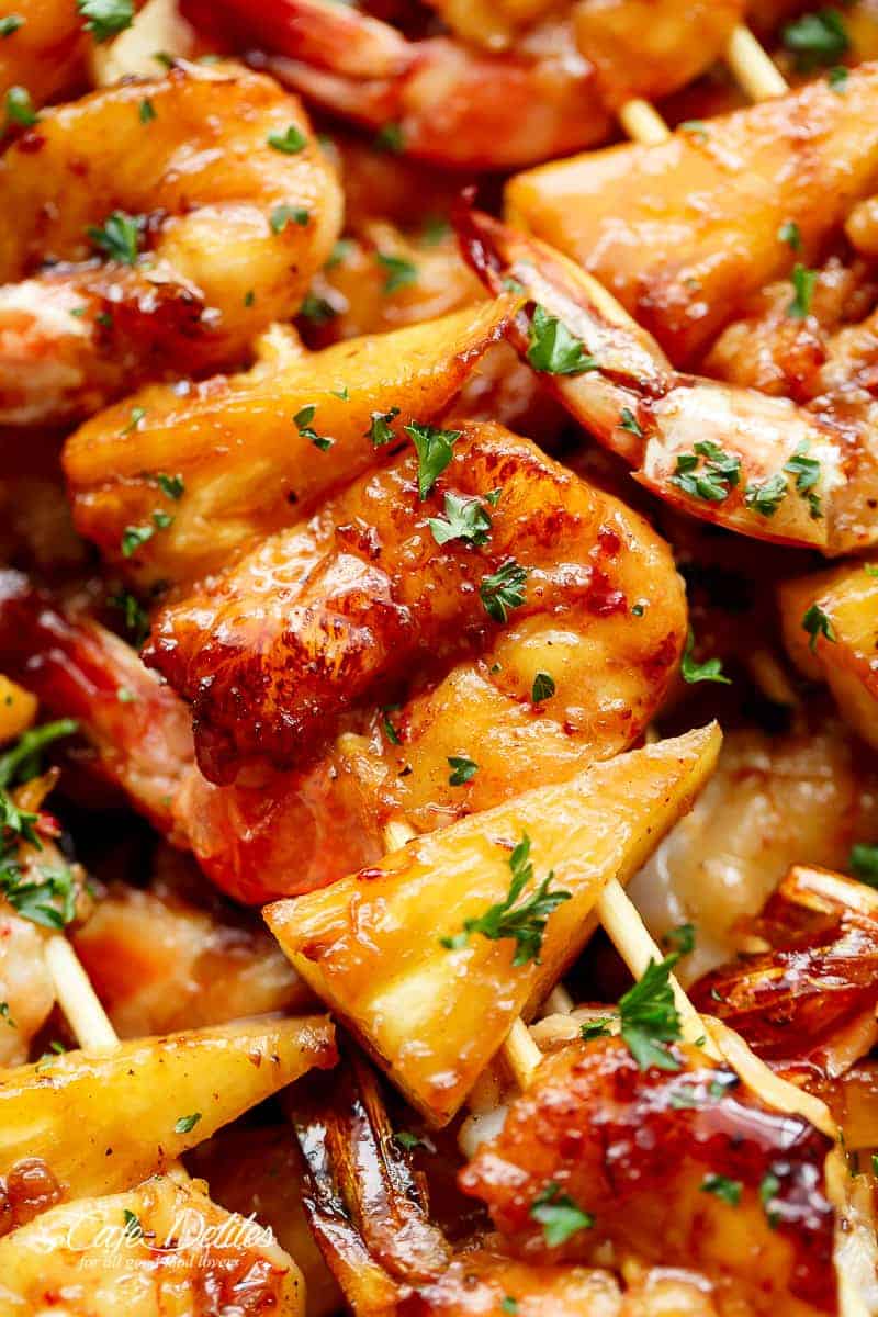 Zoom in image focusing on pineapple pieces from Shrimp Pineapple Skewers cooked in honey garlic butter sauce