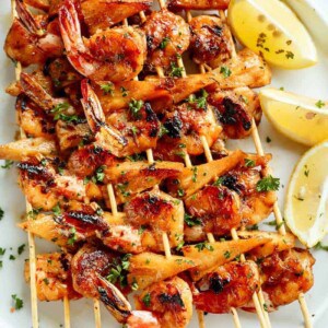 Honey Garlic Butter Shrimp Pineapple Skewers are cooked in the most incredible honey garlic butter sauce on a plater