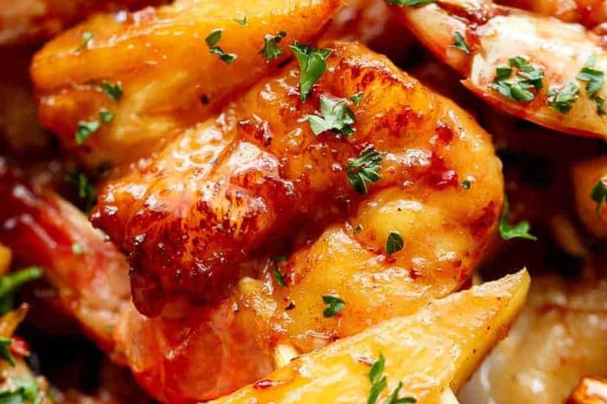 Transfer cooked skewers to a plate, drizzle with any remaining sauce, and garnish with fresh parsley.