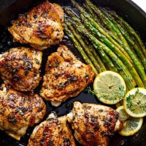 Top view of Lemon Garlic Butter Chicken Thighs with Asparagus