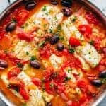 Pan Seared Fish With Tomatoes & Olives in a pan