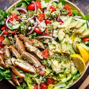 Top view of Pesto Grilled Chicken Avocado Salad using a pesto dressing to double as a marinade!