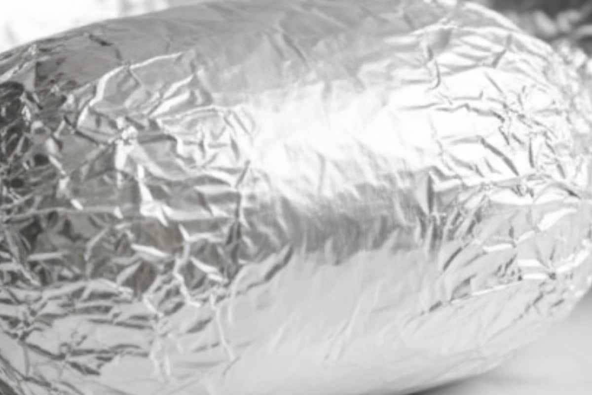 Tear heavy duty foil sheets and place the steak and potatoes in the center. Sprinkle with parsley, season with salt and pepper, then fold tightly to seal in juices.