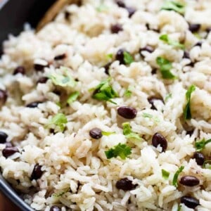 Black Beans & Rice is one of the best side recipes out there! Flavored with a squeeze of lime juice, garlic and spices, this rice recipe is a winner!