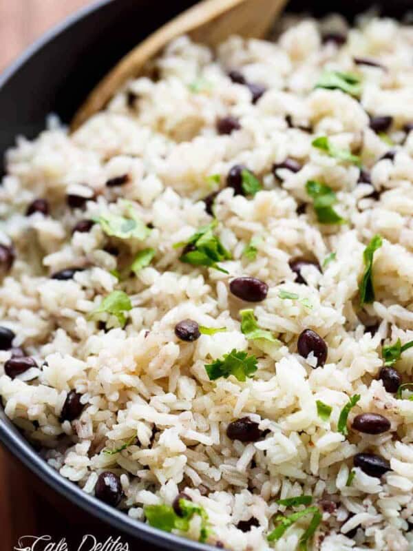 Black Beans & Rice is one of the best side recipes out there! Flavored with a squeeze of lime juice, garlic and spices, this rice recipe is a winner!