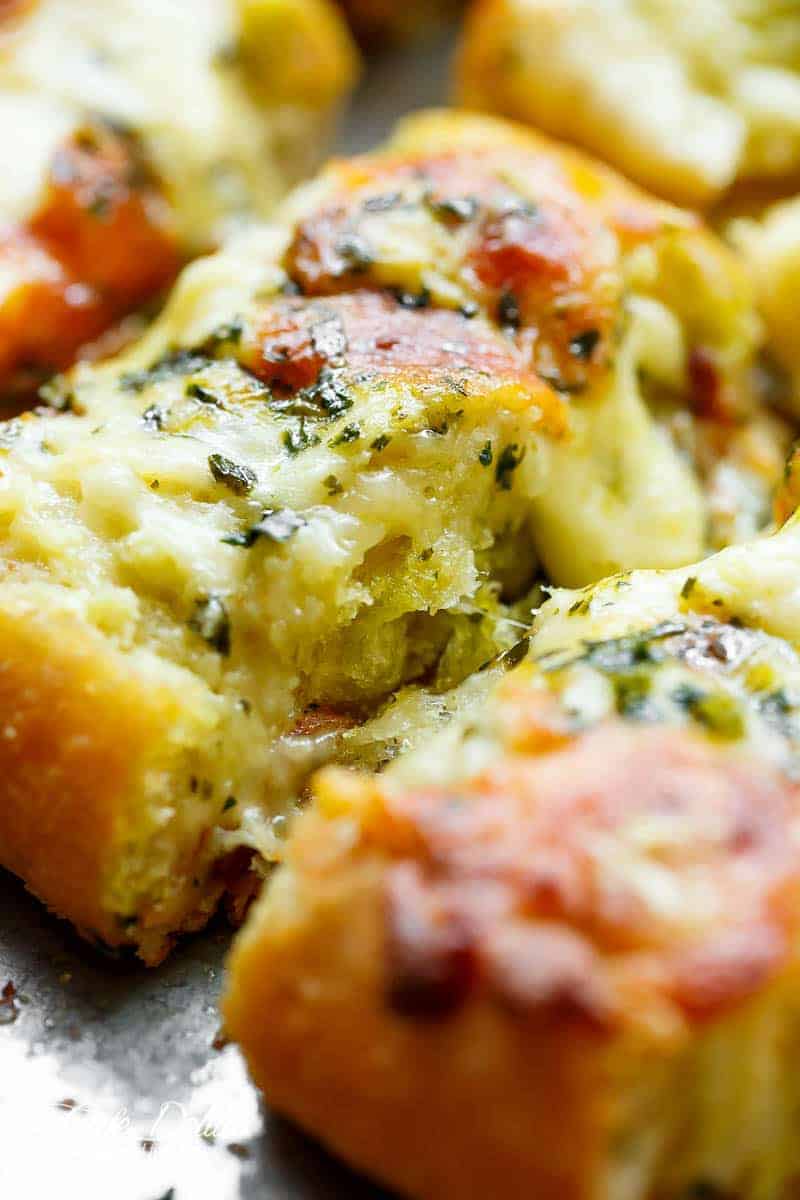 Zoom in image of a piece of Easy Cheesy Garlic Bread