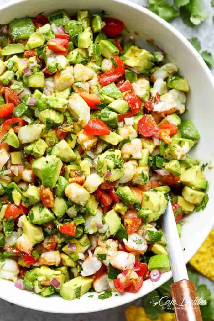 Chunky Shrimp Guacamole with spoon in a white bowl