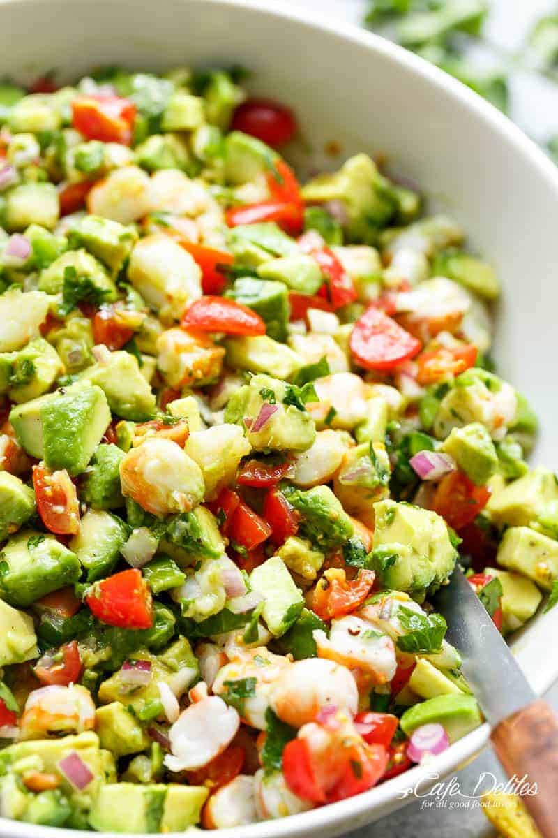 Chunky Shrimp Guacamole with spoon in a white bowl