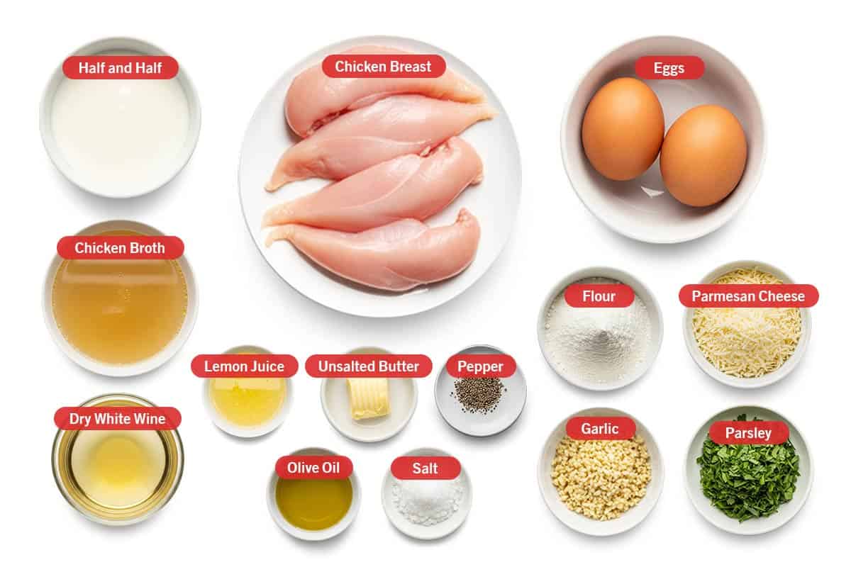 Top shot of ingredients: Half and half, chicken breast, eggs, chicken broth, dry white wine, lemon juice, unsalted butter, pepper, olive oil, salt, flour, parmesan cheese, garlic, and parsley.