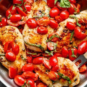 Grape tomatoes burst and cook through a buttery garlic sauce in the Garlic Tomato Basil Chicken
