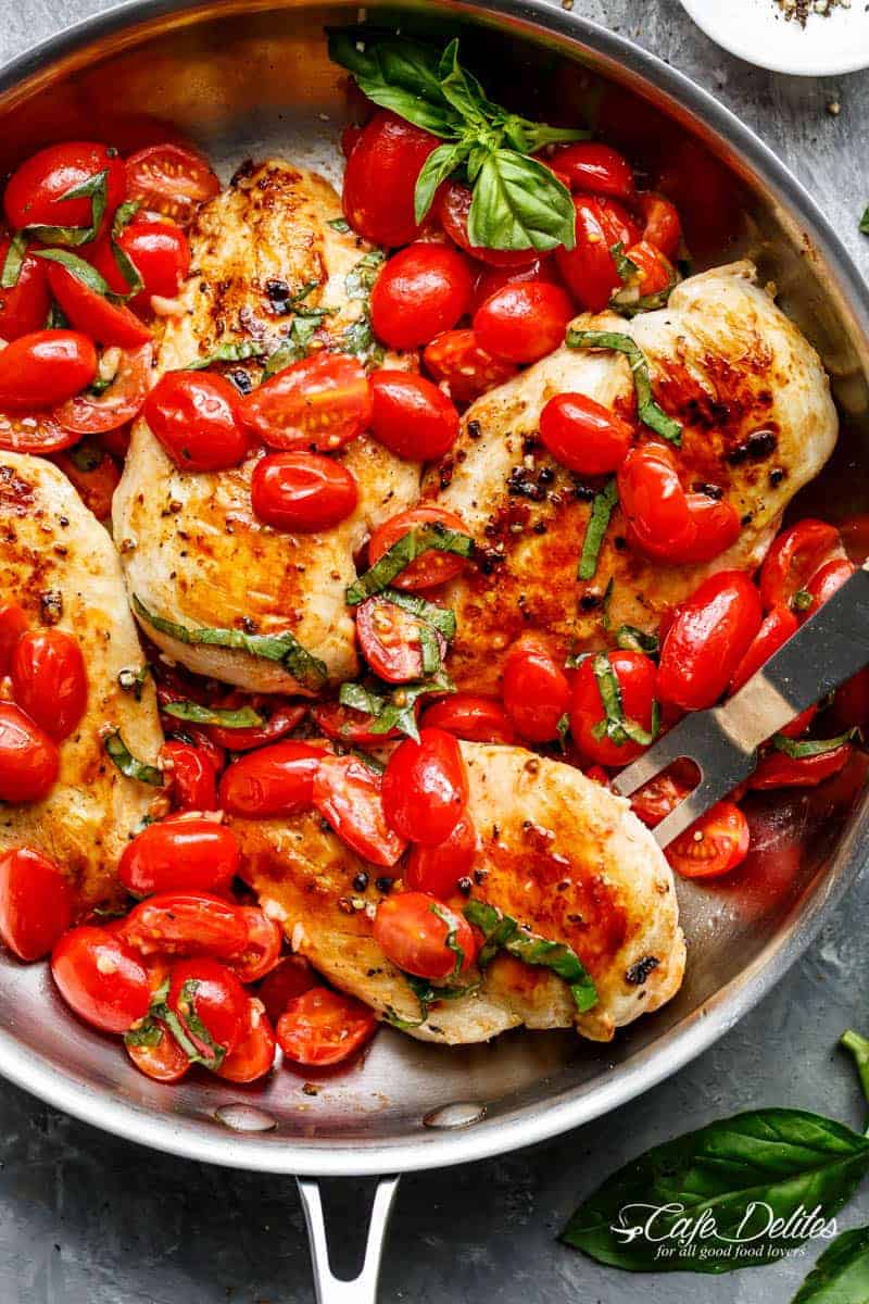 Grape tomatoes burst and cook through a buttery garlic sauce in the Garlic Tomato Basil Chicken