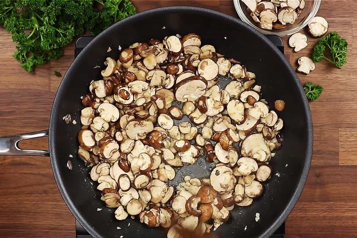 Sautéing Mushrooms in a skillet.