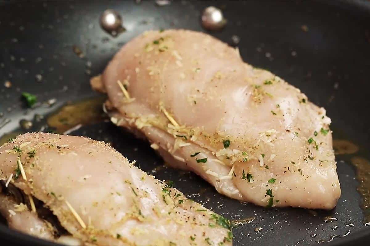 Searing the chicken.