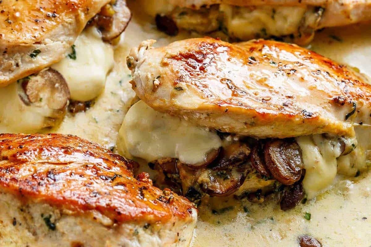 Close-up shot of Cheesy Garlic Butter Mushroom Stuffed Chicken.