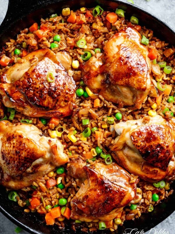 One Pan Asian Chicken and Rice equals crispy skinned chicken full of incredible Chinese-inspired flavours sits on top of a fried rice inspired skillet!
