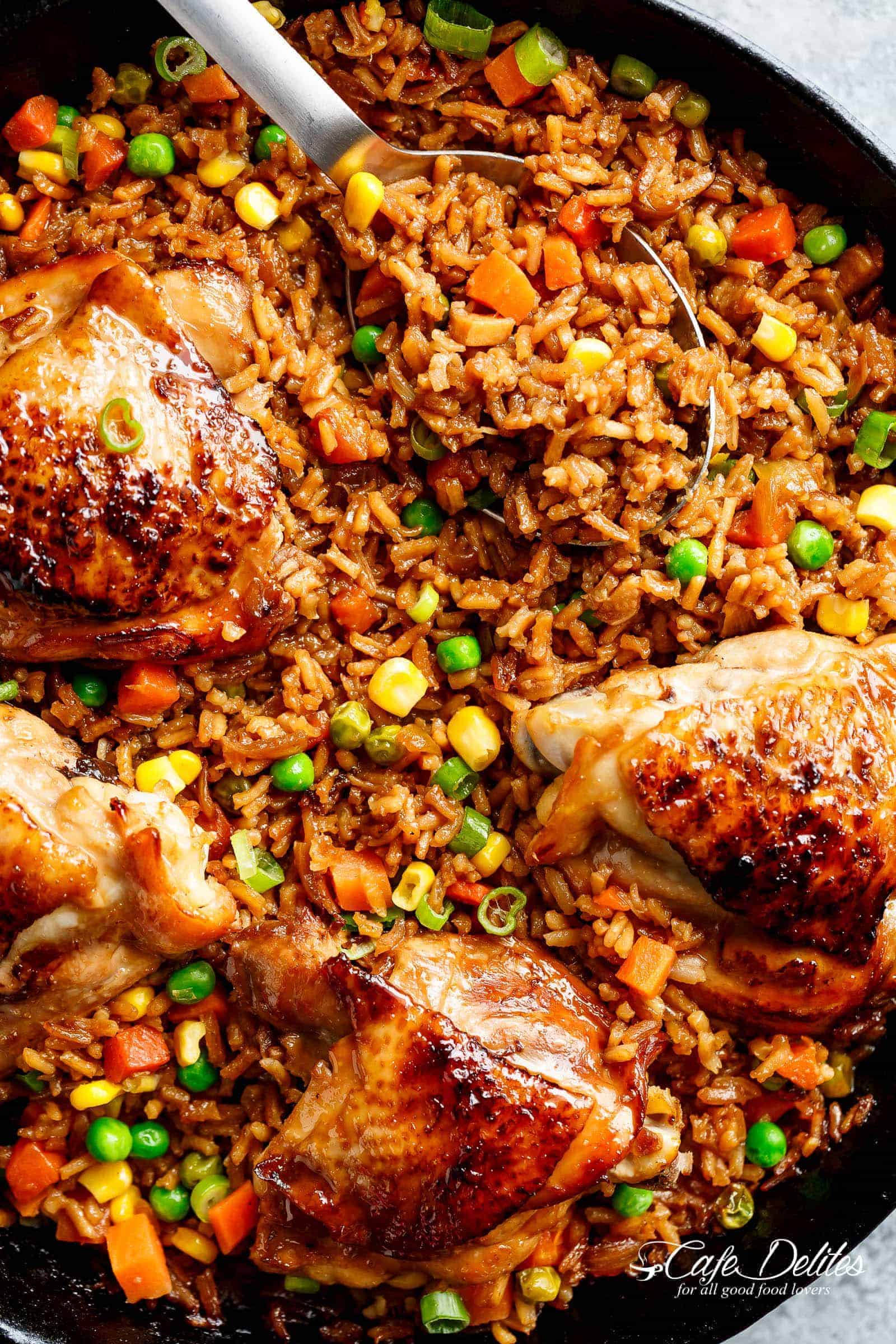 One Pan Asian Chicken and Rice equals crispy skinned chicken full of incredible Chinese-inspired flavours sits on top of a fried rice inspired skillet!