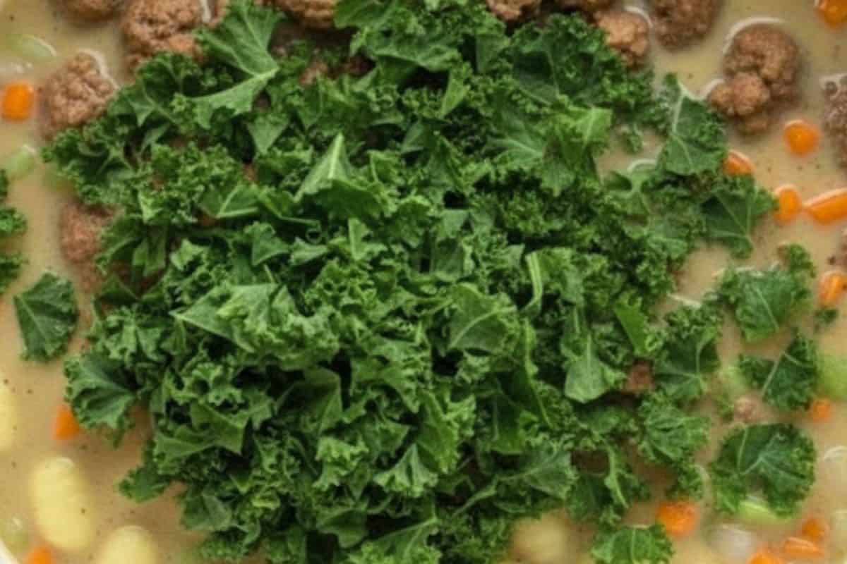 Add the chopped kale or spinach and stir gently to combine.