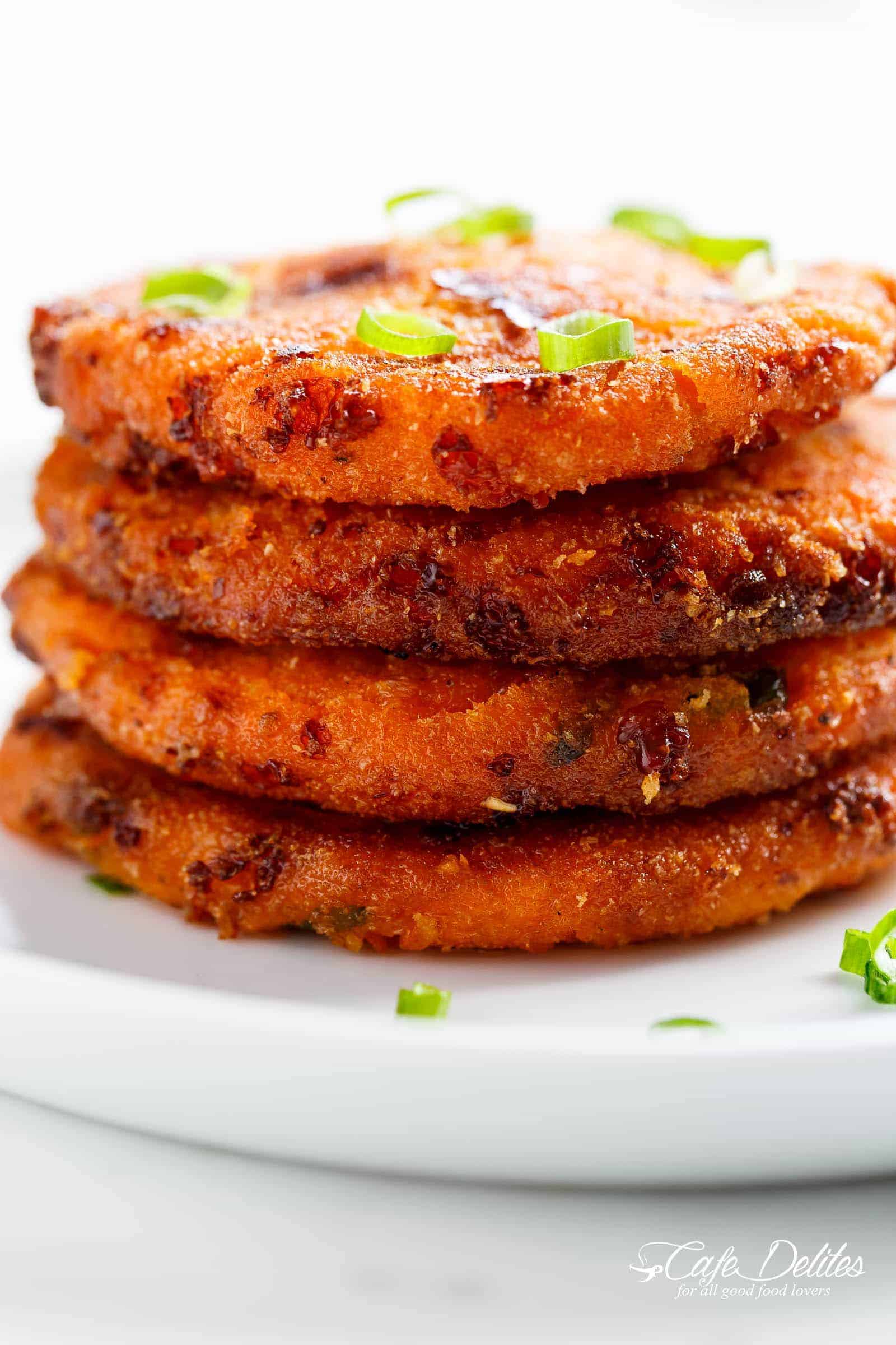 Cheesy Mashed Sweet Potato Cakes are Cheesy on the inside, so crispy on the outside stacked on each other