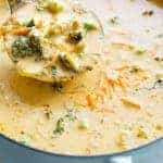 Spoon carrying on Easy Broccoli Cheddar Soup from the bowl