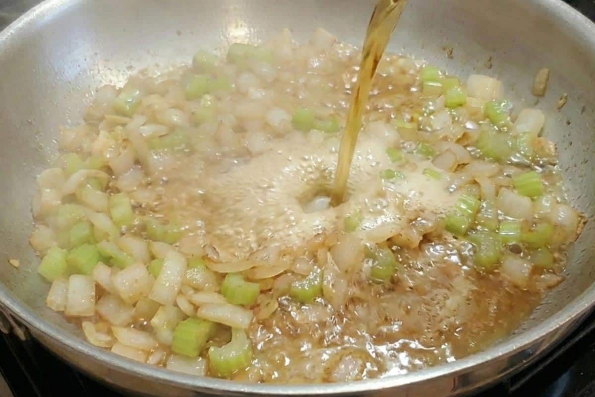 Pouring beer into the pan.