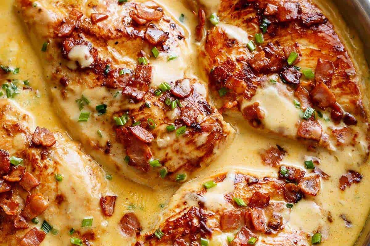 Close-up shot of Creamy Beer Cheese Chicken With Crispy Bacon (No Heavy Cream).
