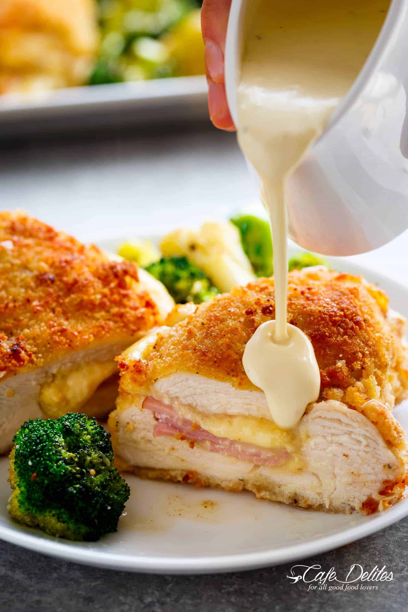 Pan Chicken Cordon Bleu, Crispy crumbed chicken breasts filled with Dijon mustard, Swiss cheese and ham, baked with vegetables and served with an incredible Dijon Cream Sauce for the ultimate restaurant feel right at home!