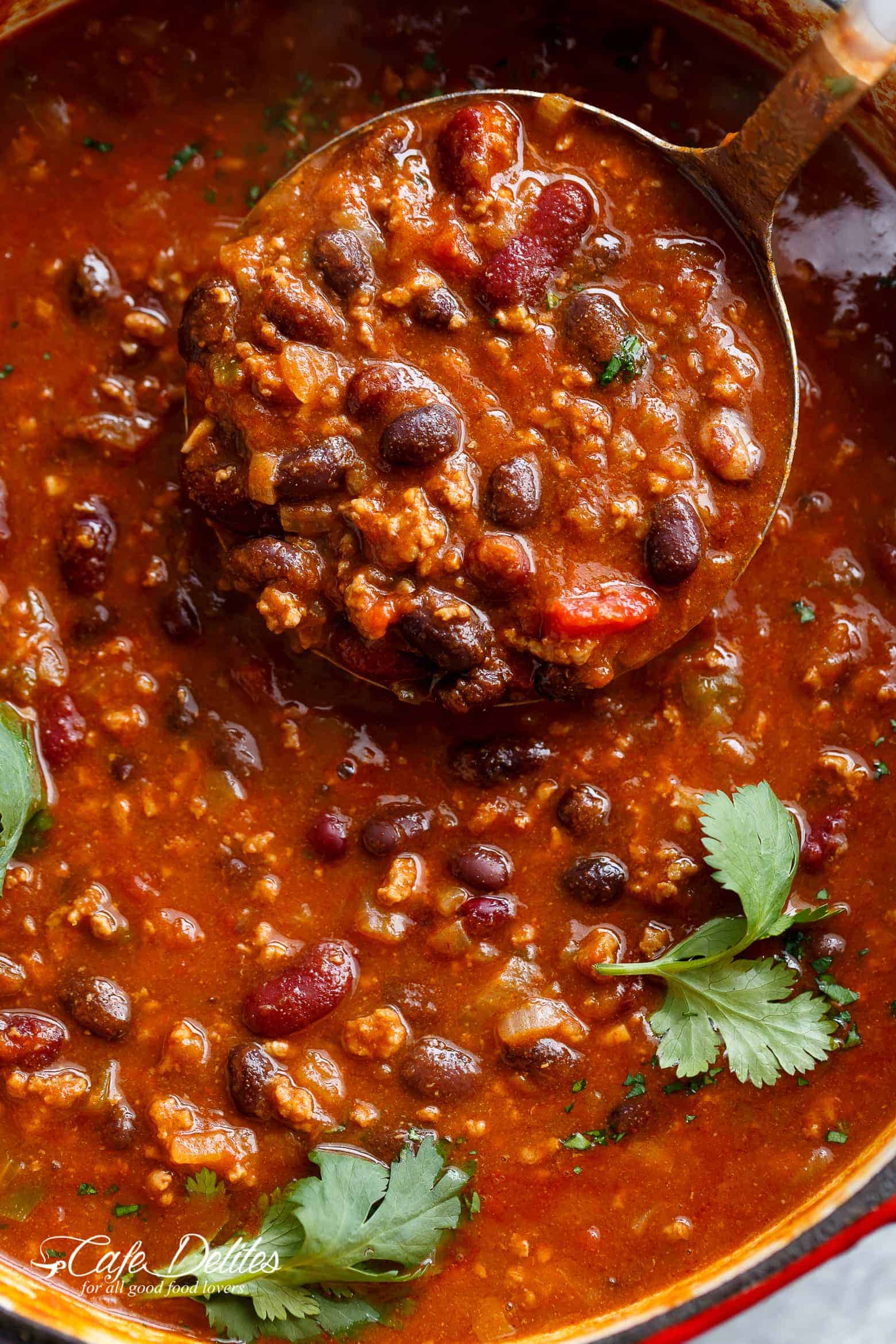 A bowl full of Full of ground beef, beans and Jalapeño peppers!
