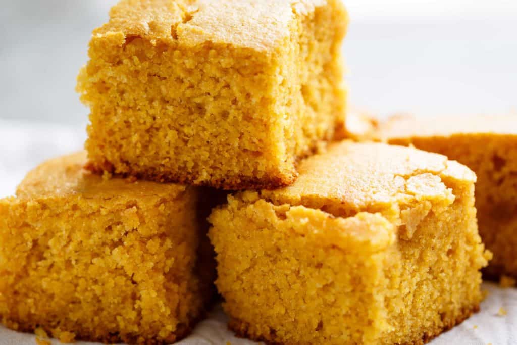 Easy Buttermilk Cornbread with a hint of honey is the perfect side to chili's, soups or stews! Crunchy buttery edges with a soft and fluffy centre!