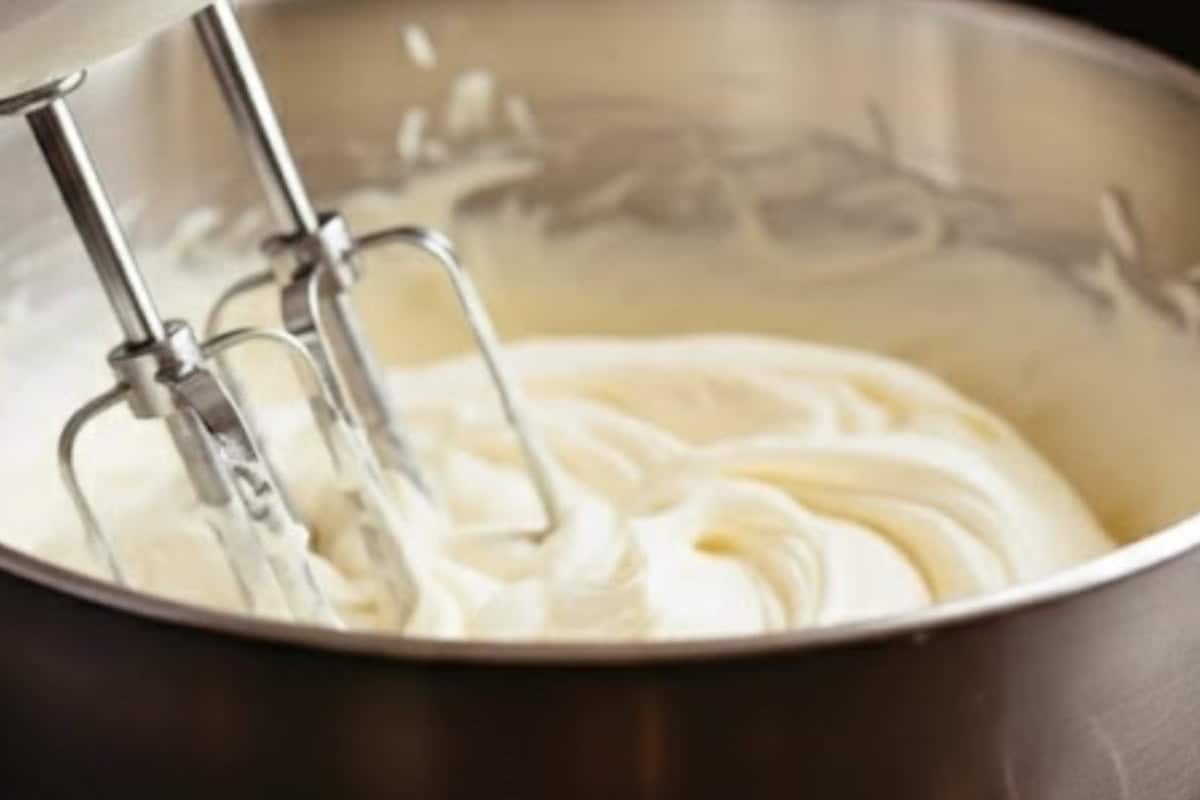 Just before serving, beat the cold cream and sugar together until soft peaks form. Add bourbon and vanilla