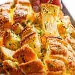A piece pulled from Bloomin' Onion Garlic Bread (Pull Apart Bread)