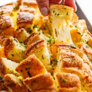 A piece pulled from Bloomin' Onion Garlic Bread (Pull Apart Bread)
