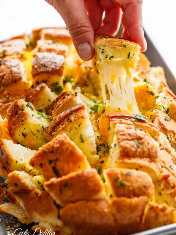A piece pulled from Bloomin' Onion Garlic Bread (Pull Apart Bread)