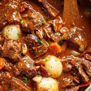 Tender fall apart chunks of beef simmered in a rich red wine gravy makes Julia Child's Beef
