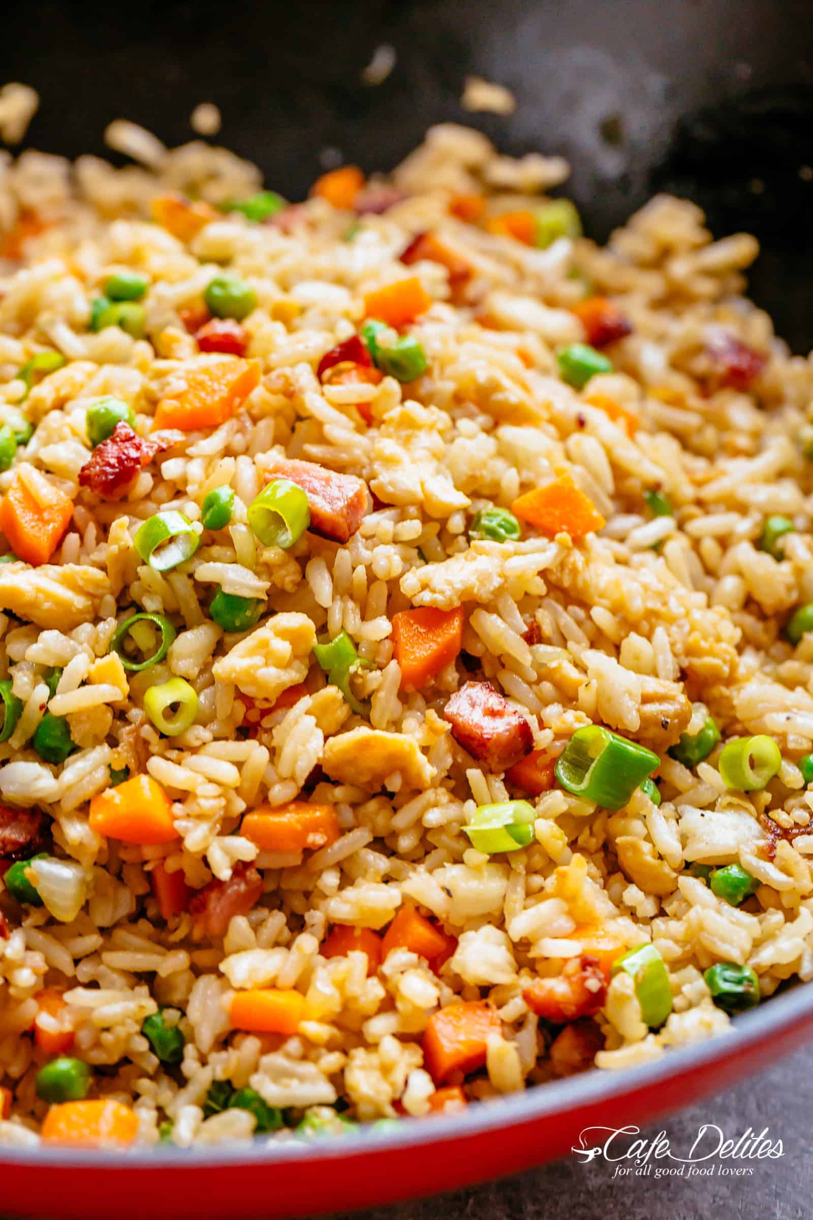 Hot fried rice with bacon in a pan