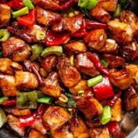 Kung Pao Chicken is highly addictive stir-fried chicken with the perfect combination of salty, sweet and spicy flavour! Make it better than Chinese take out right at home! With crisp-tender chicken pieces and some crunchy veggies thrown in, this is one Kung Pao chicken recipe hard to pass up