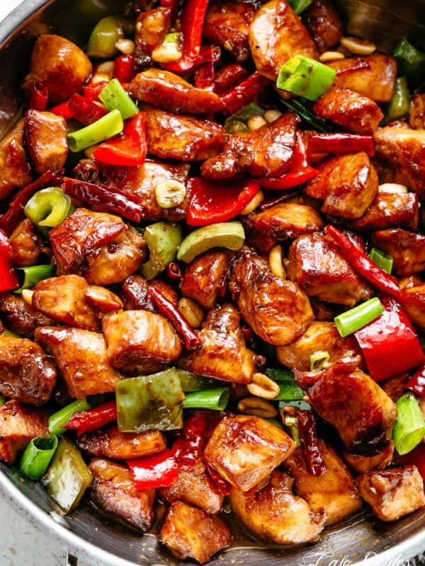 Kung Pao Chicken is highly addictive stir-fried chicken with the perfect combination of salty, sweet and spicy flavour! Make it better than Chinese take out right at home! With crisp-tender chicken pieces and some crunchy veggies thrown in, this is one Kung Pao chicken recipe hard to pass up