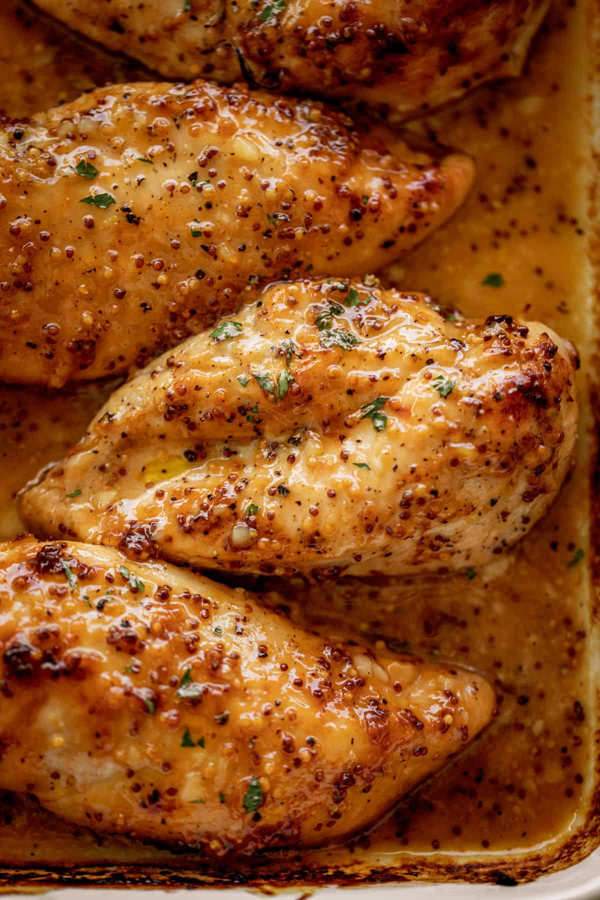 Tender and juicy Baked Chicken Breasts with a delicious honey mustard sauce with a kick of garlic and lemon juice takes only minutes to make! Baked Chicken couldn\'t be any easier to prepare for a quick and easy dinner idea! This will become your new favorite chicken breast recipe.