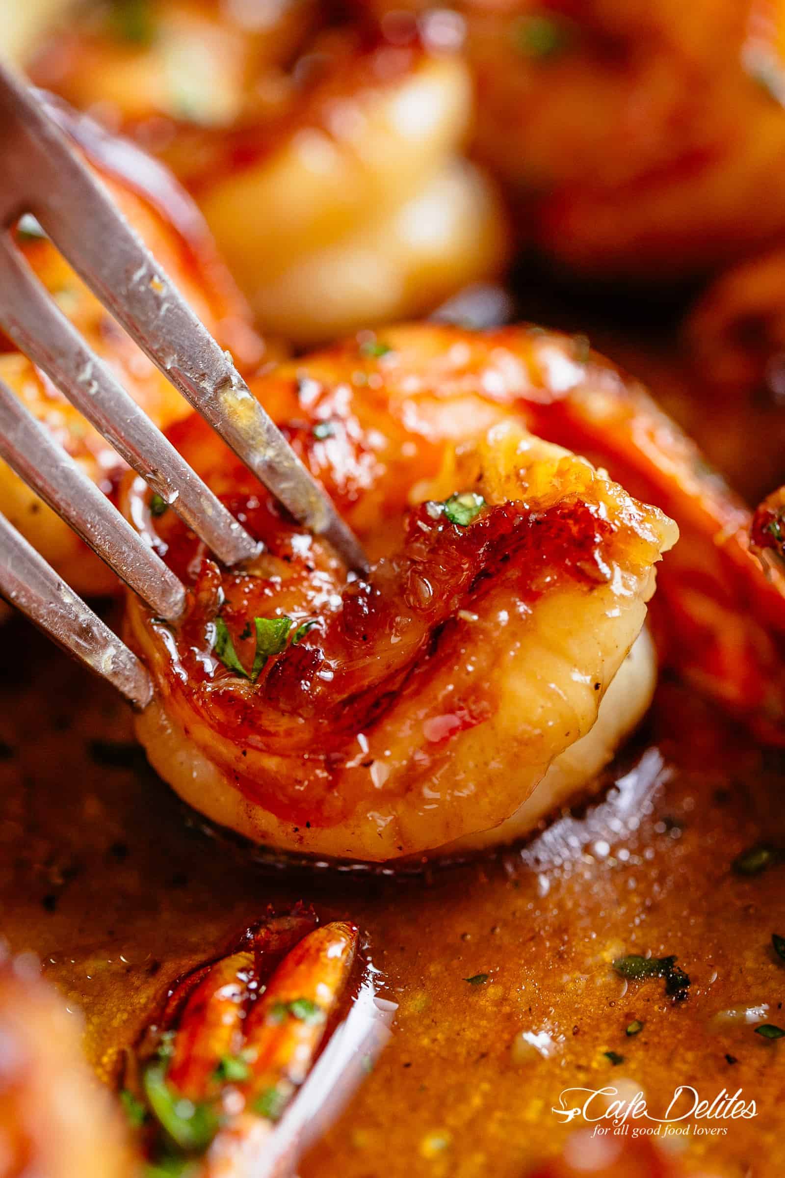 Shrimp recipes | cafedelites.com Fork pierced in Buttery Honey Garlic Shrimp