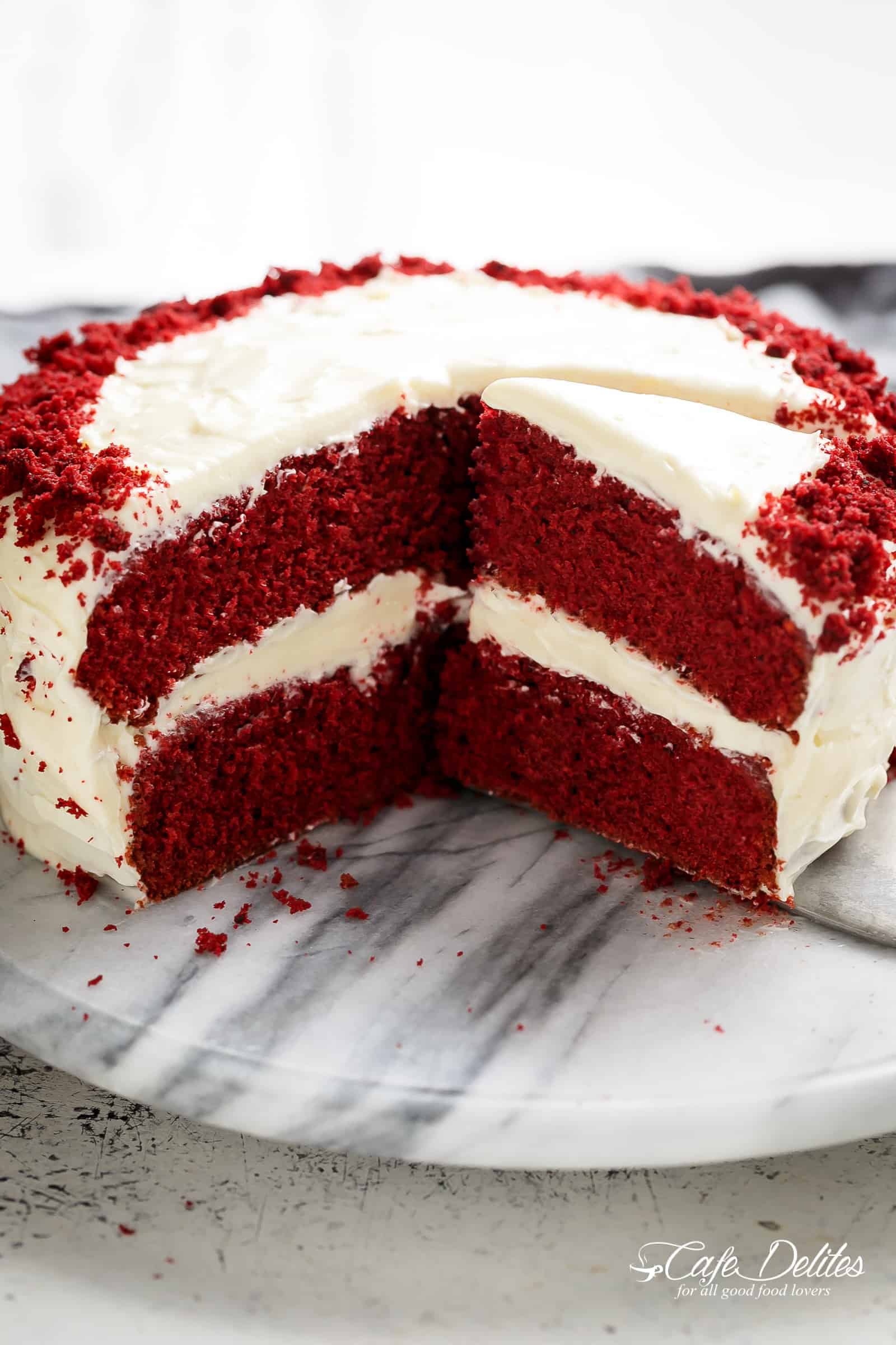 The most incredible Red Velvet Cake with Cream Cheese Frosting is fluffy, soft, buttery and moist with the most perfect velvet texture! Super easy to make with a few tips and tricks for the best results! You will go crazy for a second slice! 