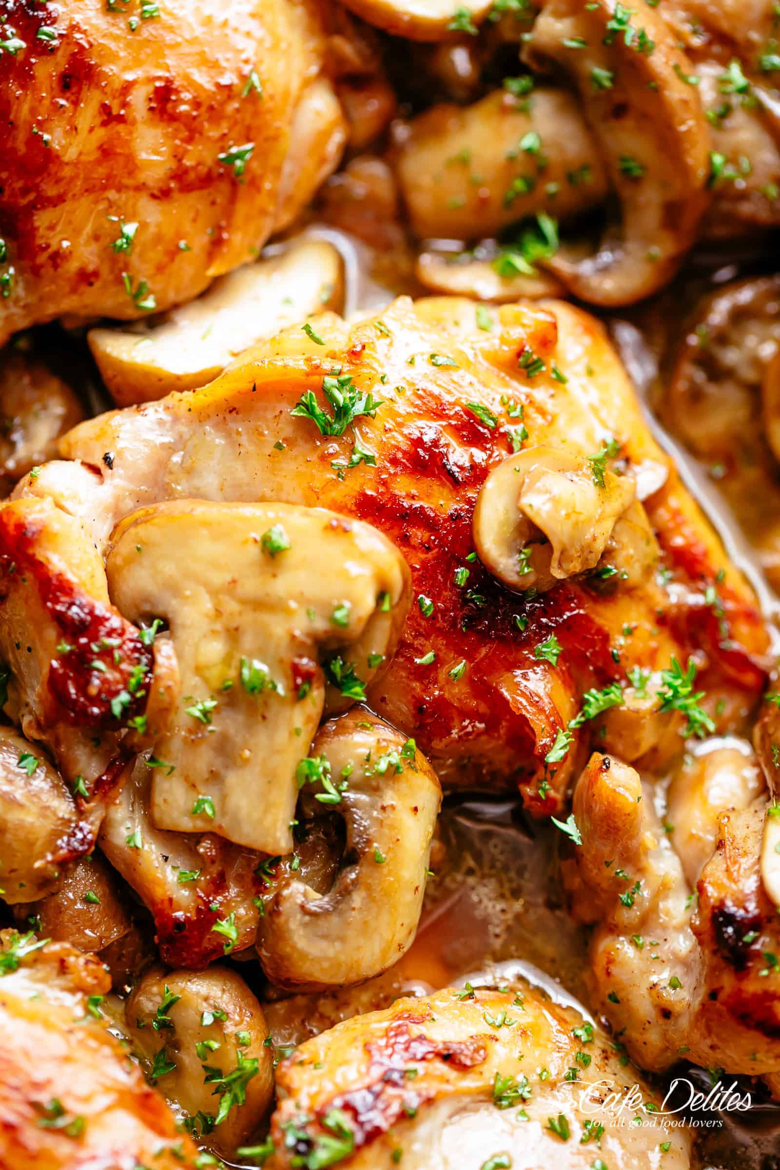 Golden seared Garlic Mushroom Chicken Thighs in a delicious, buttery sauce with a sprinkle of herbs 