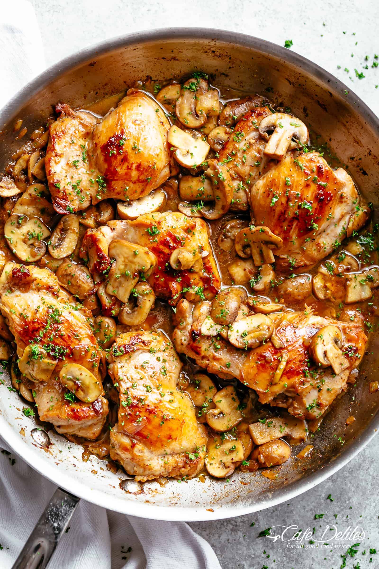 Golden seared chicken thighs with buttery garlic mushroom sauce with a sprinkle of herbs Served over rice, pasta, mashed potatoes OR lower carb options like mashed cauliflower or zucchini noodles!