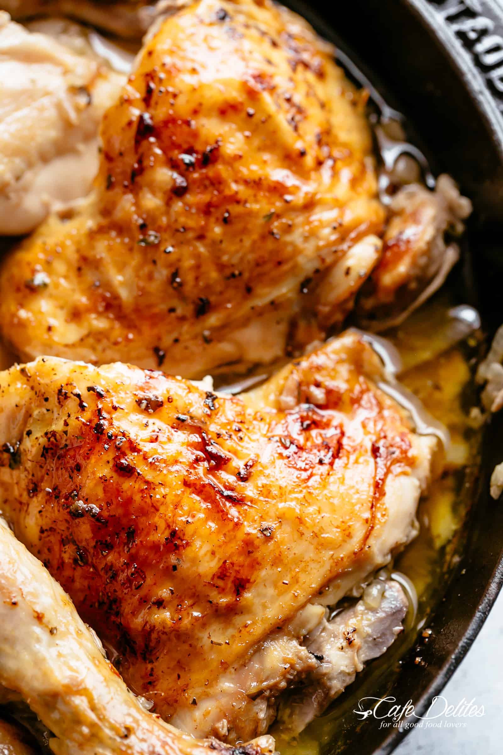 Roast Chicken portions | cafedelites.com Close up image of roasted chicken piece in a skillet.