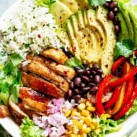 Fajita Chicken Burrito Bowl is packed with juicy golden chicken, cilantro lime rice, avocado and a delicious dressing
