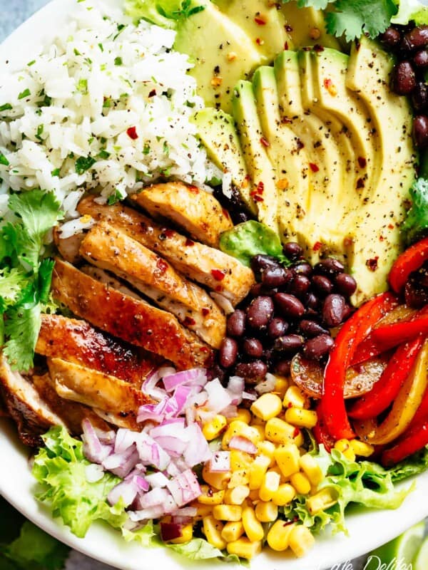 Fajita Chicken Burrito Bowl is packed with juicy golden chicken, cilantro lime rice, avocado and a delicious dressing