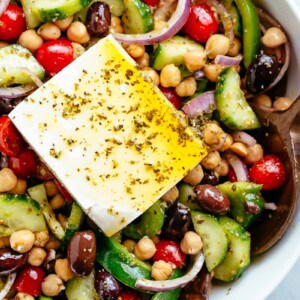 Greek Chickpea Salad with an authentic greek salad dressing in a bowl