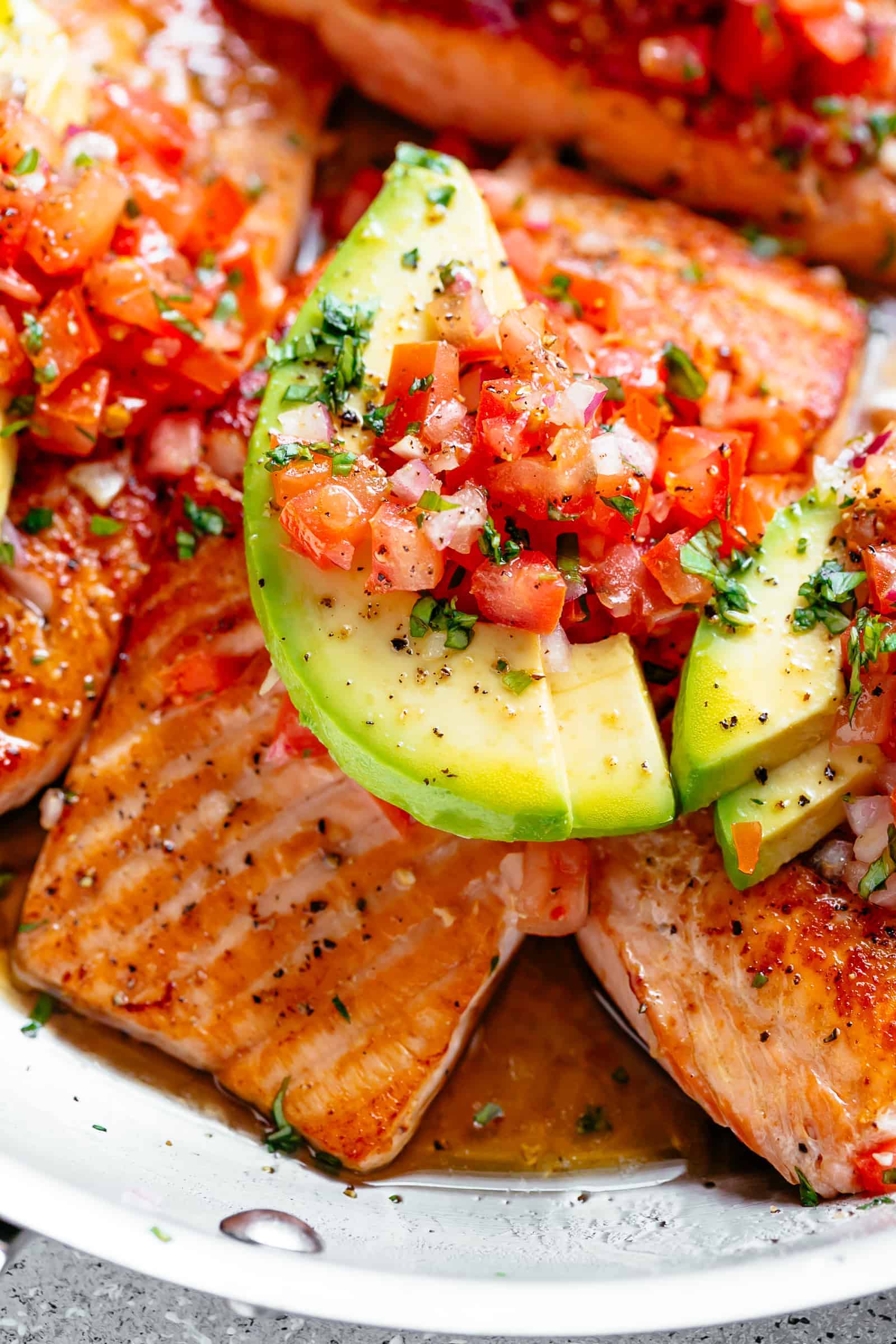 Seared Salmon | cafedelites.com Pan Seared Salmon in a buttery garlic lemon sauce, topped with a fresh tomato salsa and avocado slices!