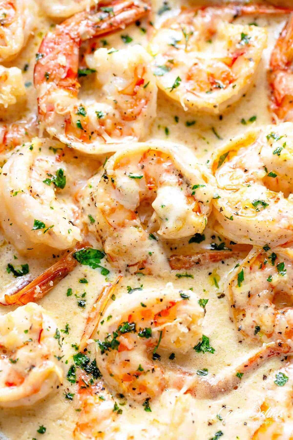Pan Seared Creamy Garlic Shrimp | cafedelites.com Close-up image of scrumptious shrimp enveloped in a velvety garlic Parmesan sauce.
