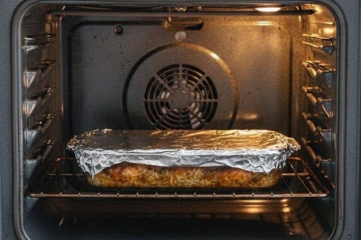 Arrange the seasoned chicken thighs over the rice, cover the dish with foil and bake for about 30 minutes.